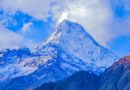 snow covered mountain under cloudy sky during daytime