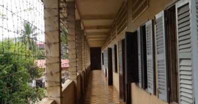 brown wooden hallway with glass windows