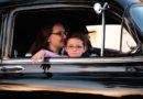 girl and woman inside black car