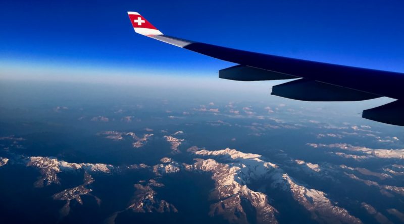 white and blue plane